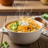 Creamy and delicious jalapeno popper soup with chicken, cheese, and tortilla strips