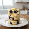 Close-up of freshly baked blueberry buttermilk biscuits with butter