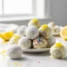 Close-up of delicious creamy lemon truffles with powdered sugar, lemon zest, and sprinkles