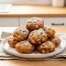 Close-up of delicious homemade air fryer apple fritters dusted with powdered sugar