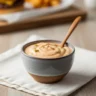 Ultimate Creamy & Tangy Smash Burger Sauce recipe in a rustic bowl, centered on a wooden table