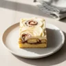 Delicious easy cinnamon roll bars with creamy glaze on a white plate