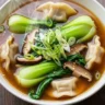 Macro close-up of steaming Quick Umami Potsticker & Bok Choy Harmony Soup with chicken potstickers, shiitake mushrooms, and baby bok choy.