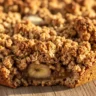 Golden Spiced Banana Oat Crumble in a rustic baking dish, warm and comforting, with a crispy golden topping.