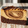 A close-up of a slice of Velvety Mocha Swirl Brownie Cheesecake Bliss, showing distinct layers of fudgy brownie, creamy cheesecake, and espresso swirls.
