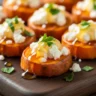 Macro close-up of Golden Honey-Feta Roasted Sweet Potato Bites with fresh parsley.